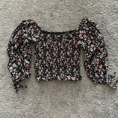 Black floral smocked blouse with long sleeves