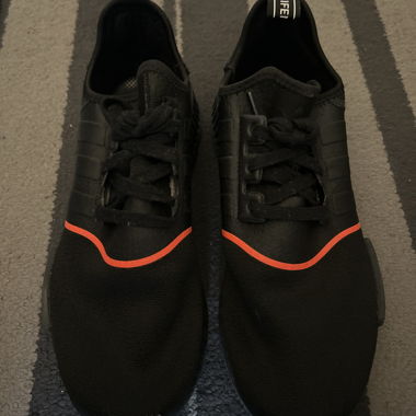 Black sneakers with red trim