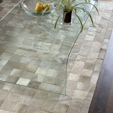 Designer cream checkered cowhide rug