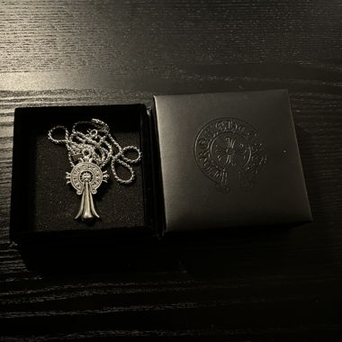 Silver-coloured necklace with pendant