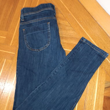 Women's dark blue jeans with worn effect