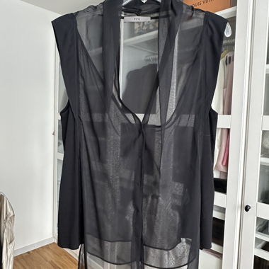 Blouse en mousseline de chiffon noire transparente, sans manches