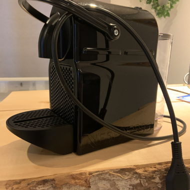 Black Nespresso capsule coffee machine