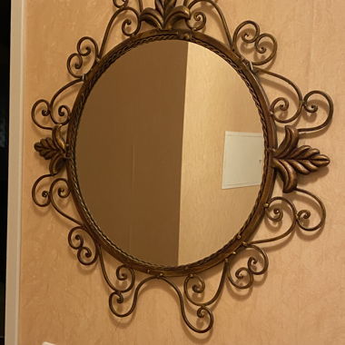 Miroir rond avec motif en fer forgé 