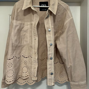 Denim jacket with eyelet pattern