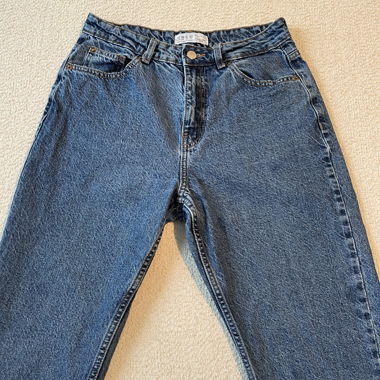 High-waisted blue denim jeans