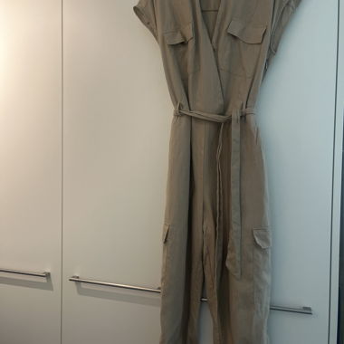 Beige jumpsuit with waist belt