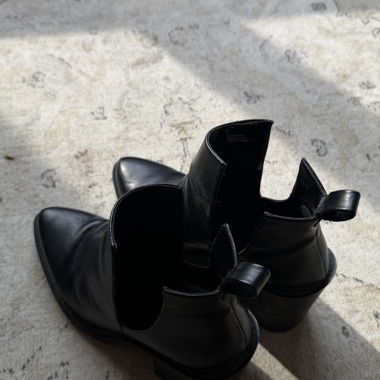 Black heeled ankle boots with cut-outs