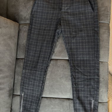 Pantaloni casual grigi a quadri con cerniera