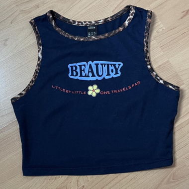 cute navy blue top with a leopard pattern detail