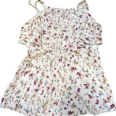 Top smanicato bianco con motivo floreale
