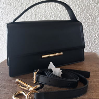 Black handbag with shoulder strap