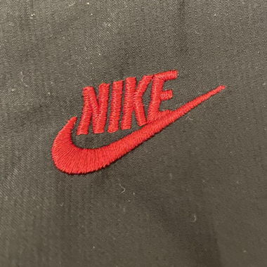 black/grey nike sweatpants with red details