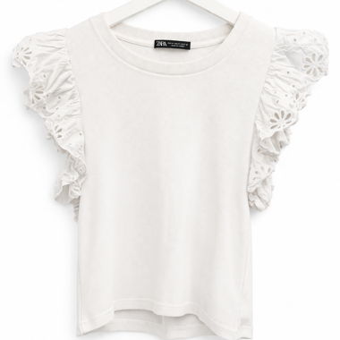 Top bianco con maniche a balze