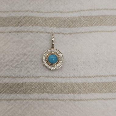 Silver-coloured pendant with turquoise stone
