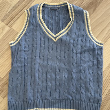 Blue sleeveless knitted vest with V-neck