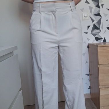 Pantaloni beige a gamba larga