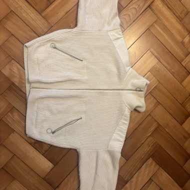 Gilet en tricot blanc avec fermeture éclair
