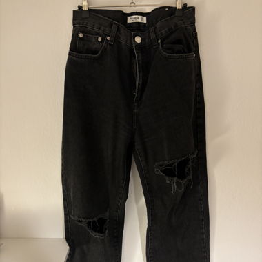 Jeans neri strappati