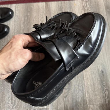 Black Dr. Martens loafers with fringe