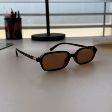 Brown glasses with gold details