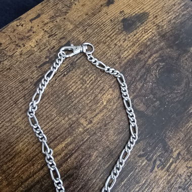 Pants tag or big bracelet.