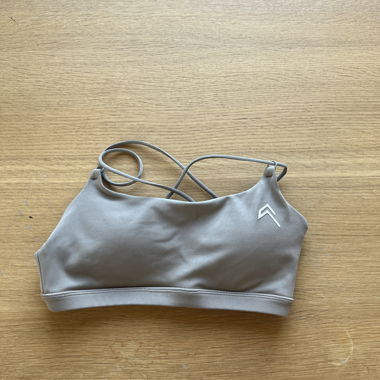 Taupe sports bra with crisscross straps