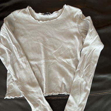 White frilly top