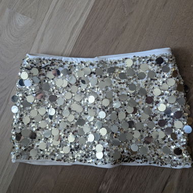 Gonna mini con paillettes dorate