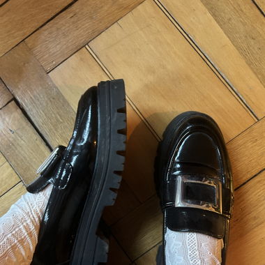 black patent loafers with silver buckle 
