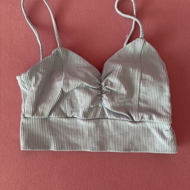 Top a costine azzurro chiaro con bretelle
