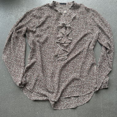 Blusa Sisley stampata con volant