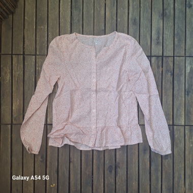 Pink long-sleeve blouse with ruffles