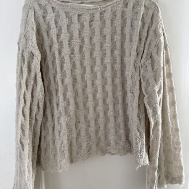 Maglione beige lavorato a maglia grossa con struttura