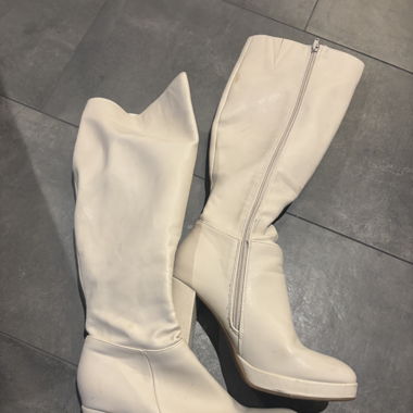Cream knee high boots