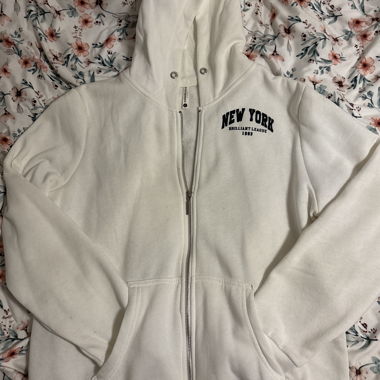 una giacca bianca con zip New York SENZA il laccio!