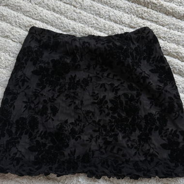 Black mini skirt with floral pattern