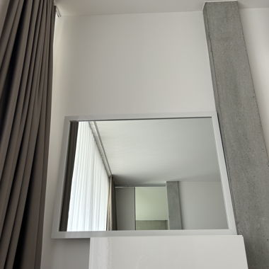 Wall mirror with white frame