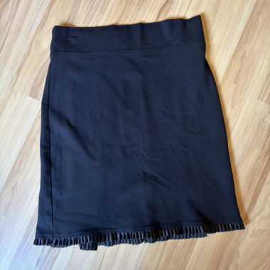 Black skirt with pleated hem