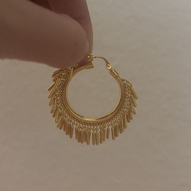 Gold-coloured hoop earrings with fringe design