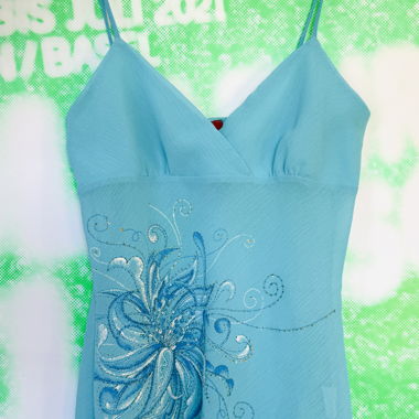 Light turquoise tank top with sparkling details
