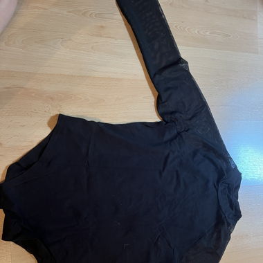 Top a maniche lunghe con manica in rete