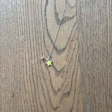 Silver-tone necklace with yellow star 