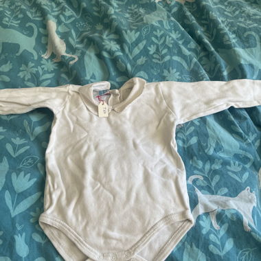 White baby bodysuit with long sleeves