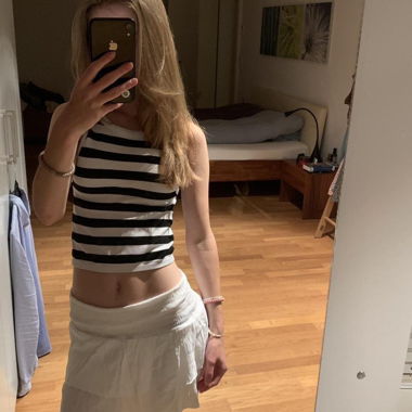 Top sans manches rayé noir et blanc