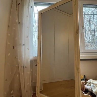 Large freestanding mirror with decorative frame