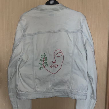Denim jacket with embroidery in the back