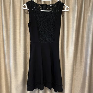 black dress with decorative floral neckline