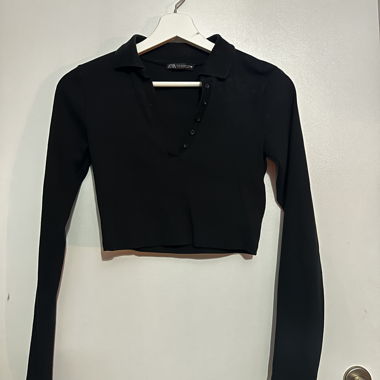 Top polo corto nero a maniche lunghe