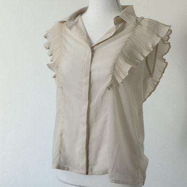 Blouse beige sans manches